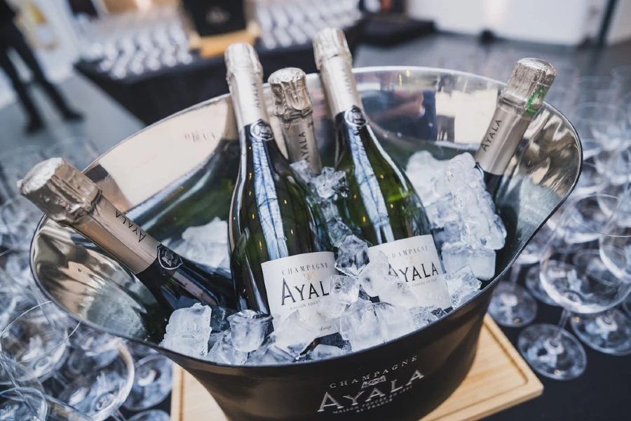 Close-up of wine bottles in ice bucket
