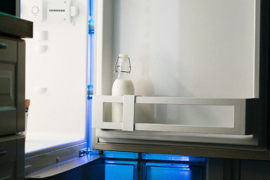 Milk bottle on refrigerator door shelf