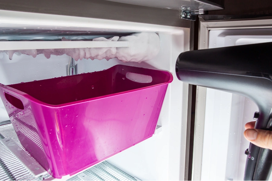 freezer during defrosting process using hairdryer