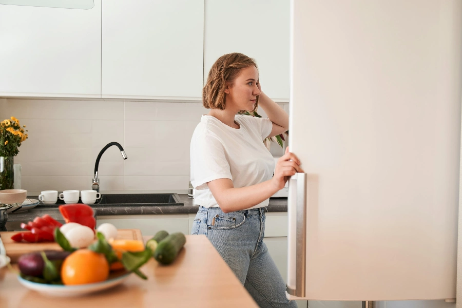 woman opening the fridge